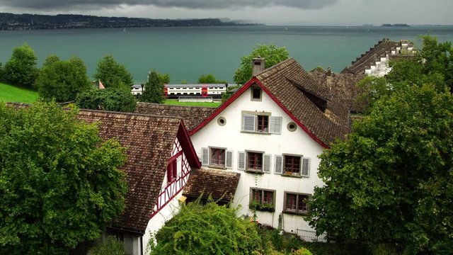 Beautiful view of swiss train in Richterswil village on lake Zurich Zürichsee in Switzerland