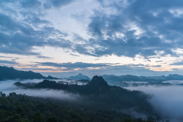 Mountain view with foggy environment during sunrise