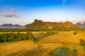 Fototapeta premium Aerial view of the fields and mountain. Beautiful landscape. Laos.