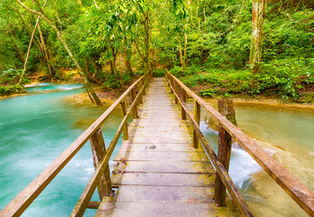 Bridge on the way to Tat Sae Waterfalls. Beautiful landscape. Laos.