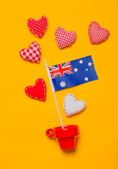 Red cup with heart shapes and flag of Australia