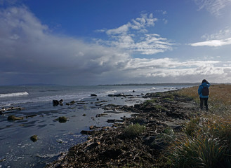 An unidentifiable beach comber at Fort Stevens State Park along the Columbia river in Warrenton Oregon.
