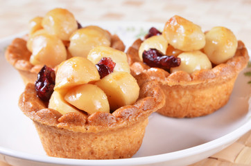 Macadamia nuts tart on white plate  