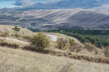 Country road amidst hills and mountains