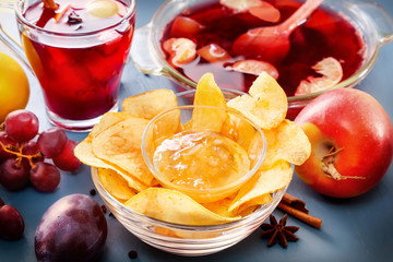 Winter alcoholic drinks - mulled wine, punch, grog with cornflakes Glass glasses with mulled wine....