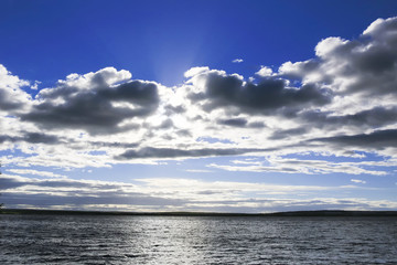 Dark clouds and lunar path on sea