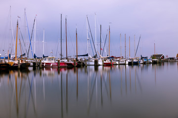 Fototapeta premium Long exposure of fishing ships in North Holland - Netherlands