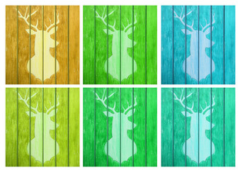The figure of a deer on a wooden texture in the set of six variants in different colors