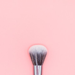 Top view of Makeup brush on Pink Pastel plastic texture background. Pastel color concept, Minimal concept. Copy space
