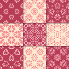 Cherry red and beige floral ornaments. Collection of seamless patterns