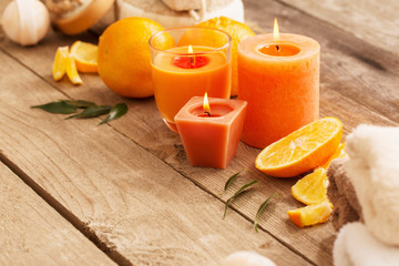 spa concept with orange fruits on old wooden background