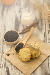 Sesame Cookies, sesame and milk on black wooden background