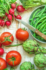Fresh Organic Vegetables Artichokes Green Beans Tomatoes Red Radish Broccoli on Wood Garden Kitchen Table Vegan Clean Eating Mediterranean Diet Preparing Meal Top View Kinfolk