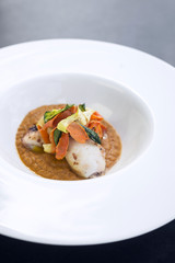 gourmet fusion cuisine squid with pickled vegetables in pumpkin curry