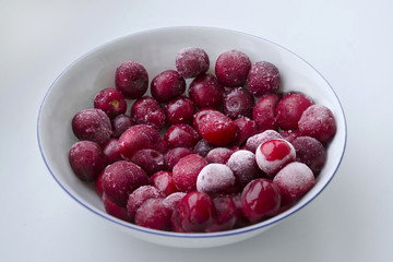 Juicy red cherries on a bright white background.