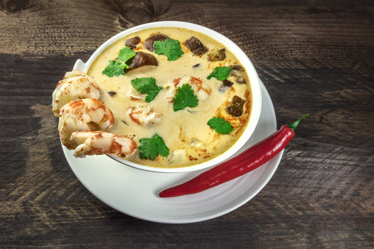 Tom Yam, traditional Thai soup with shrimps and mushrooms, with chilli pepper