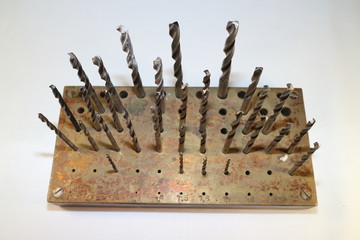 A convenient storage for drills of different diameters on a white background