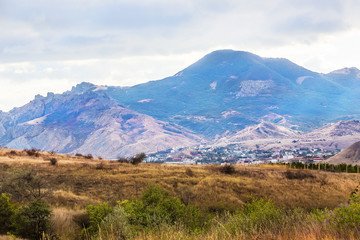 Mountain forest landscape under evening sky