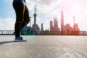 Fototapeta na wymiar walking man in the summer at bund Shanghai city view background