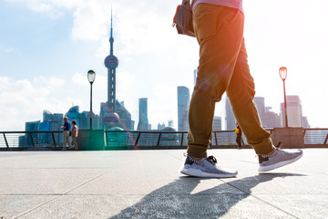 walking man in the summer at bund Shanghai city view background - obrazy, fototapety, plakaty