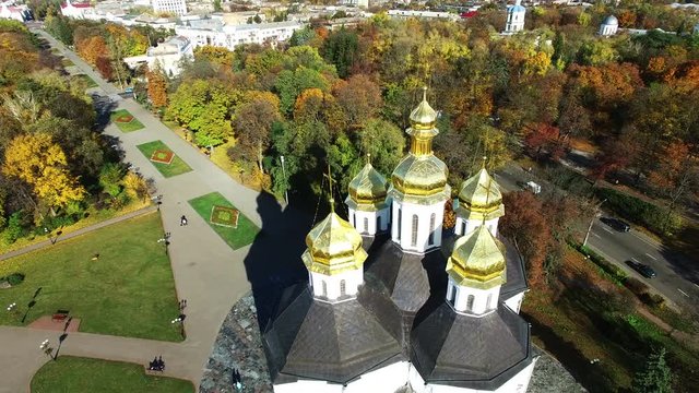  4K  Aerial. Fly over   Christian  orthodox church, autumn city.Domes