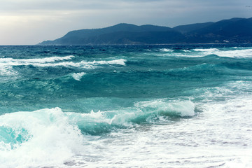 Naklejka na ściany i meble Sarti, Greece, Aegean Sea, soft storm at sea cost, water background 