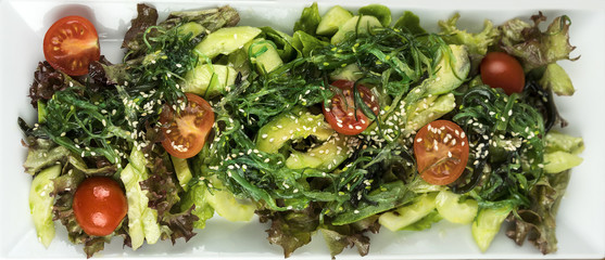 Fresh salad with cherry tomatoes, avocado