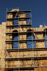 Scaffolding on the exterior walls of the Odeon of Herodes Atticus, Athens, Greece during restoration process.
