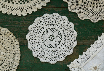 Set of vintage lace napkins on rusted wooden background - 183590924