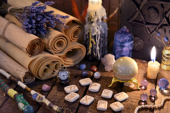 Ancient paper scrolls with runes and magic crystals. Occult, esoteric, divination and wicca concept. Mystic and vintage background