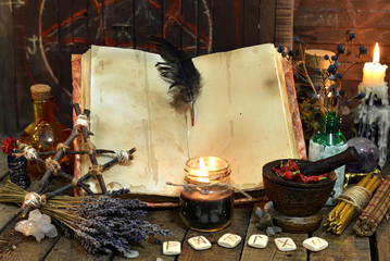 Old witch book with empty pages, lavender flowers, pentagram and witchcraft objects. Occult,...