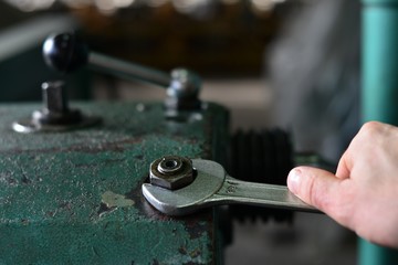 worker press start button on panel control for start CNC machine