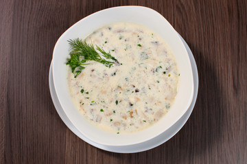 Greek chicken soup in a bowl isolated on white / Greek chicken soup isolated / Greek chicken soup with herbs