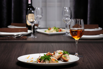 luxury dinner served on the table with glass of wine