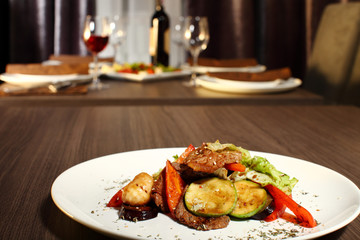 luxury dinner served on the table with glass of red wine