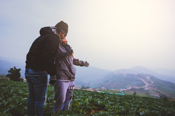 Lover women and men asians travel relax in the holiday. Stand up look landscape on the mountain in the morning. Thailand