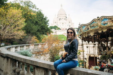 Beautiful girl is walkin in paris near the basilica