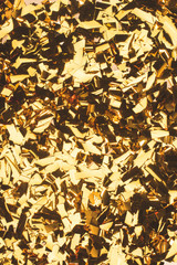 close up view of sparking golden confetti