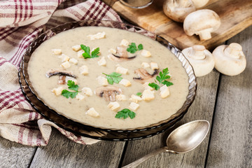 Mushroom cream soup with croutons and spices