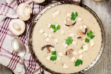 Mushroom cream soup with croutons and spices