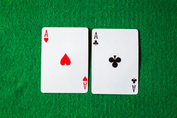 cards in poker, two aces on green background with copy space