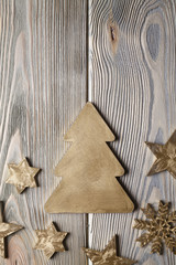 Christmas tree, stars and snowflake on wooden board