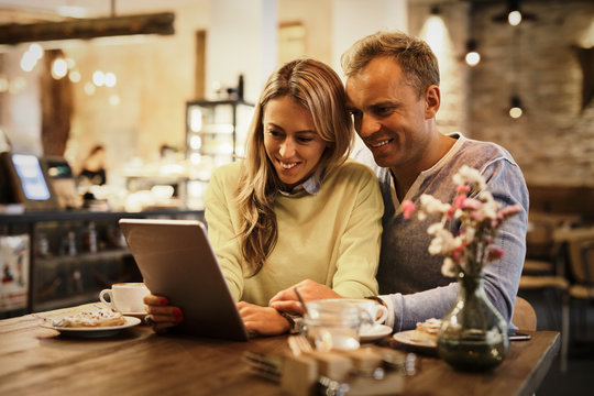Couple looking at tablet computer together
