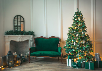 Christmas living room with a fireplace, sofa, Christmas tree and gifts. Beautiful New Year decorated classic home interior. Winter background