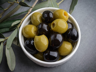 Olives with olive branch and olive oil, view from above