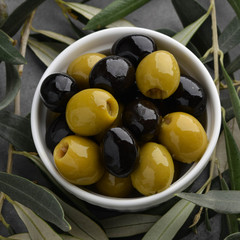 Olives with olive branch and olive oil, view from above
