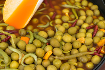 Olives with olive branch and olive oil, view from above