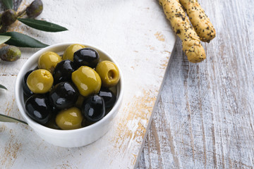 Olives with olive branch and olive oil, view from above