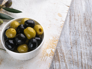 Olives with olive branch and olive oil, view from above