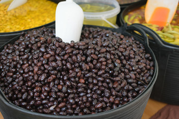 Olives with olive branch and olive oil, view from above